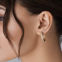 Channel-Set Cubic Zirconia Oval Hoop Earrings in Brass